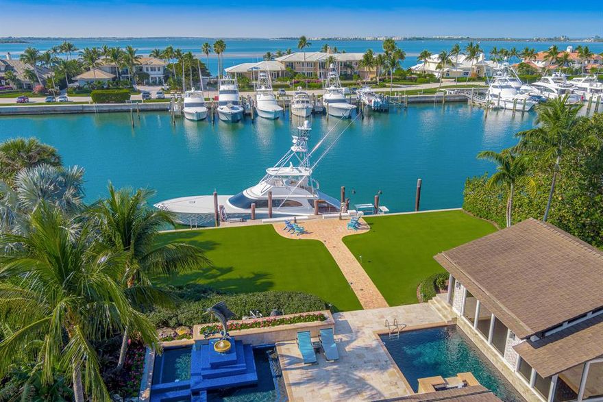 Located behind the gates of one of the world's most prestigious communities, this stunning home has everything you could want, and more! Residents of Sailfish Point have exclusive access to the oceanfront, Jack Nicklaus-designed golf course, 5 restaurants, a fitness center, a tennis facility, a full-service marina, and much more! This gorgeous, custom home boasts 4 bedrooms, 5.5 bathrooms, 3 car garage, and can accommodate up to a 90' vessel, right in your own backyard with zero Marina cost! Only a quick 55-mile trip to the gorgeous blue waters of the Bahamas makes this a fisherman's paradise!
