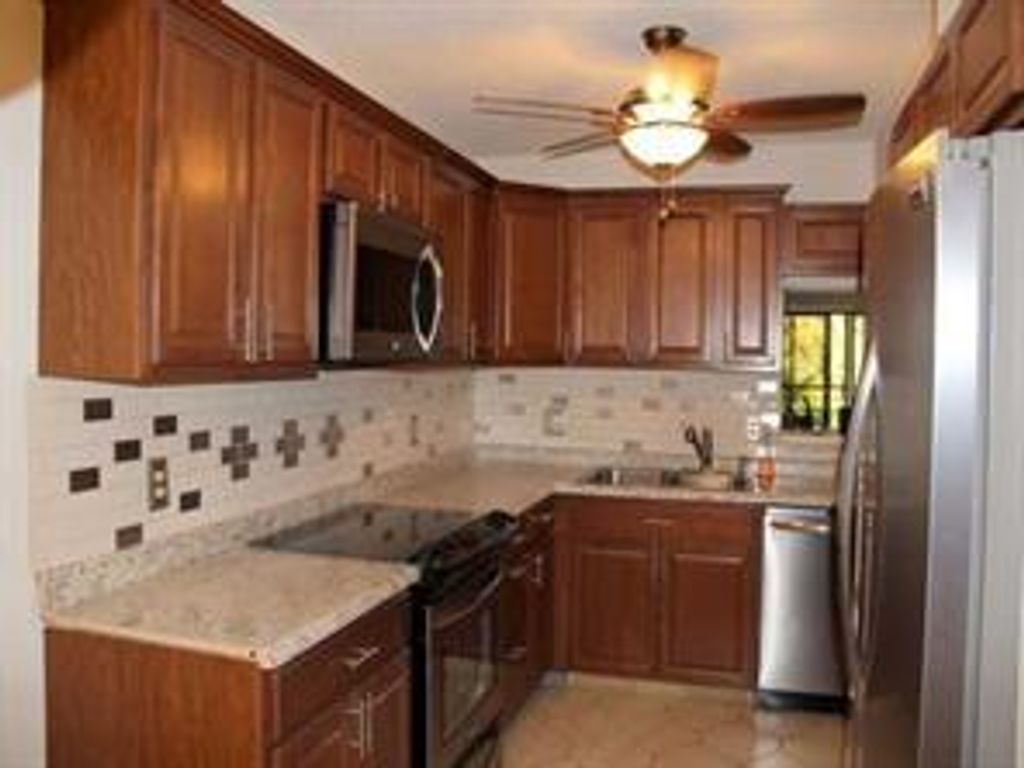 Photo of 10143 Mangrove Dr #203, Boynton Beach, FL 33437 (MLS # F10301908)
