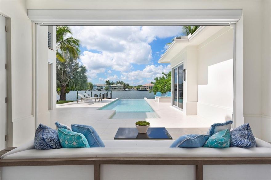 Artfully designed, this chic coastal contemporary estate combines the finest of custom finishes with a choice Deepwater Intracoastal setting. Completed in 2018, this exceptional five bedroom 5 1/2 bath residence was constructed by Lost Craft Builders and designed by Richard Jones Architecture, and enjoys an unparalleled lifestyle in the exclusive Seagate neighborhood of Delray Beach. Painstaking attention to detail is evident in the selections of stunning porcelain and wood flooring, Lutron system, imaginative glass encased stairwell, and exquisite wall coverings. A luxurious first floor master suite offers panoramic wide water views.  Often these include a parade of yachts cruising past, in a no wake zone. Private deep water dockage can accommodate substantial watercraft.  Cont'd in MORE