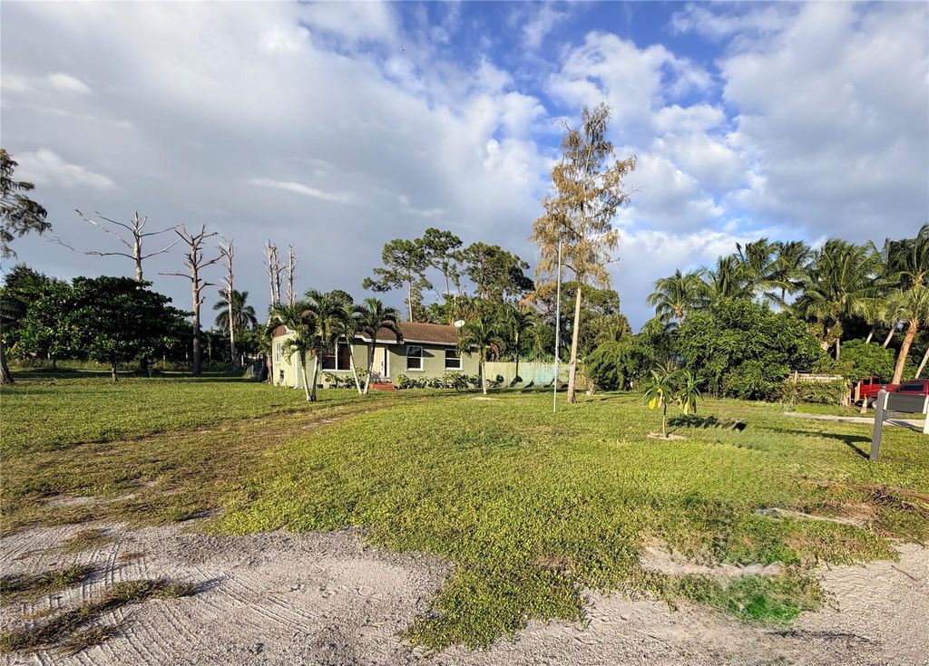 Photo of 5211 Pine Grove Dr, West Palm Beach, FL 33417 (MLS # F10533692)
