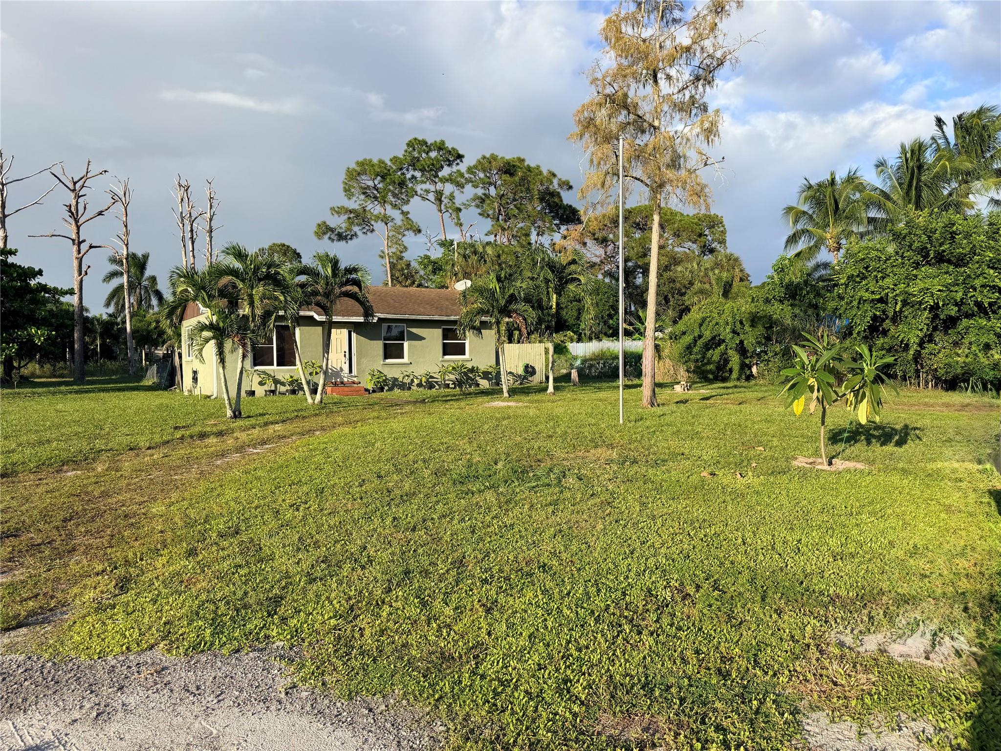 Live here or develop. Beautiful property! Private 3/4-Acre Lot Minutes from Everything – Zoned Multi-Family High Density
CCRT Revitalization Corridor, zoned RH – Multi-Family High Density with potential for three -3 Units through Palm Beach County’s density programs. 
Zoning: RH through the Workforce Housing Program (WHP) and Transfer of Development Rights (TDRs).
Opportunity Zone: 
Prime Location: Close to Palm Beach International Airport, I-95, Florida’s Turnpike, shopping, dining, and beaches.
Perfect setting for multi-family, workforce housing, or a contractor’s yard with equipment and trailer storage (with approval).
Room for trailers, RVs, horses, or large equipment with approval