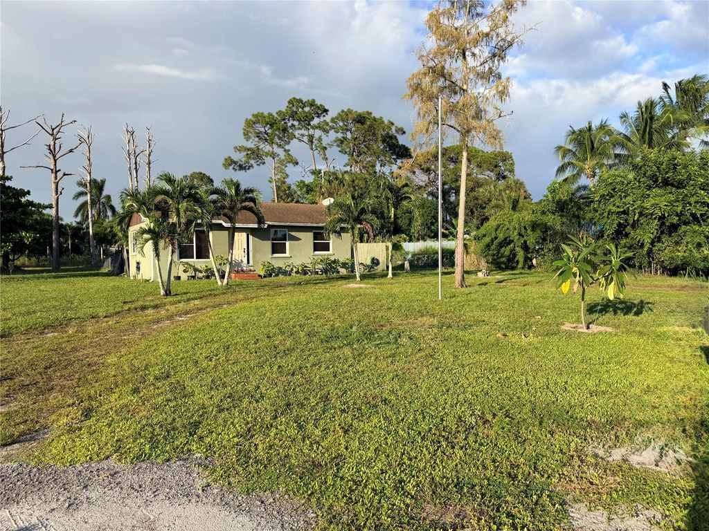 Photo of 5211 Pine Grove Dr, West Palm Beach, FL 33417 (MLS # F10533692)