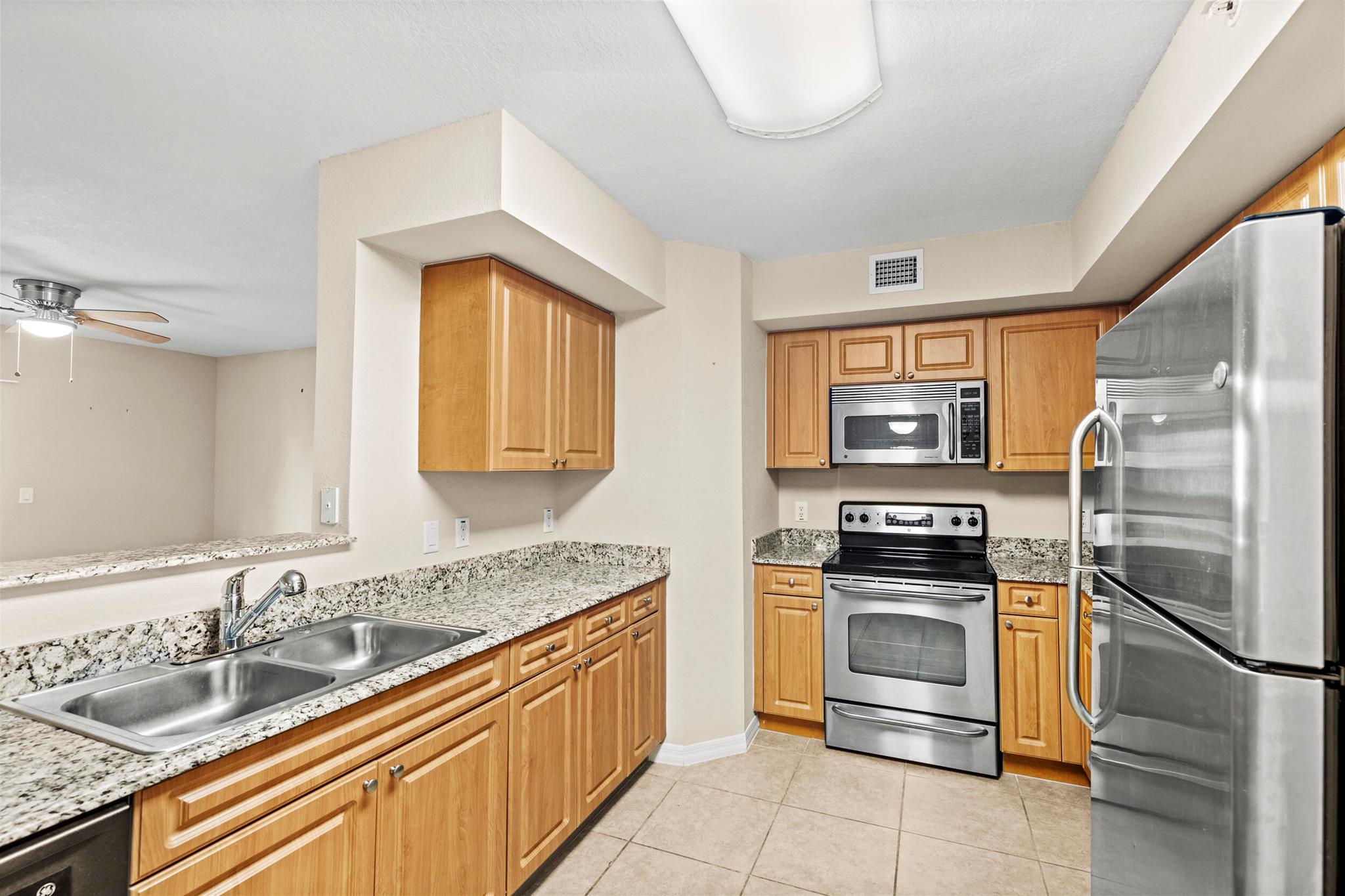 This beautifully maintained 3-bedroom, 2-bath first-floor home offers the perfect blend of comfort and convenience in the heart of Boynton Beach. Step inside to a bright, open layout with tile flooring in the main areas, carpet in the bedrooms, walk-in closets in each bedroom, a spacious kitchen, a cozy living area ideal for relaxing or entertaining and a desk for studying or projects. HOA includes water, sewer and basic cable.Enjoy plenty of parking right outside your door, plus access to amazing community amenities including a sparkling pool, kiddie pool, playground, clubhouse, and state-of-the-art fitness center. Whether you're lounging poolside or breaking a sweat in the gym, you'll feel right at home.