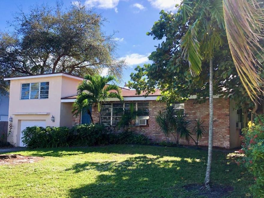 Terrific Multi level Home on a 136 ft Deep lot only steps away from Mizner Park!! This home offers 3 Bed, 2 Bath,  Granite Kitchen with Wood cabinetry, Wood and Tile Flooring, Huge Resort style Pool and South facing back yard