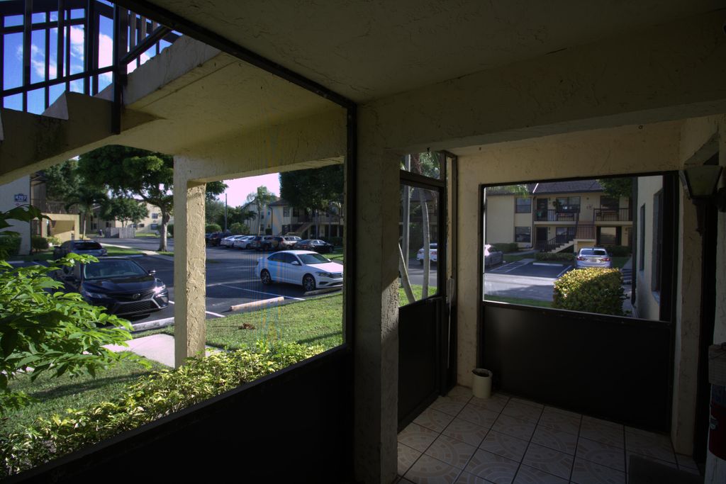 Photo of 4703 Lucerne Lakes Boulevard E #101, Lake Worth, FL 33467 (MLS # R11102869)