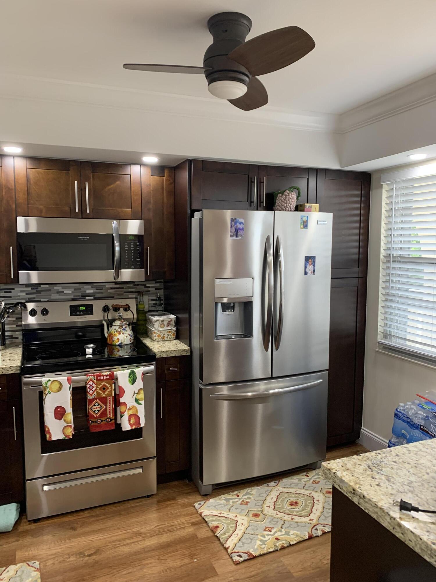 Cozy 2/2 on the Fairway Golf Course is ready for a new owner! Property features Laminate floors, spacious upgraded kitchen, enclosed patio with golf course view, upgraded master bath, walk-in closet, washer/dryer, hurricane shutters and so much more. Make this your home today!
