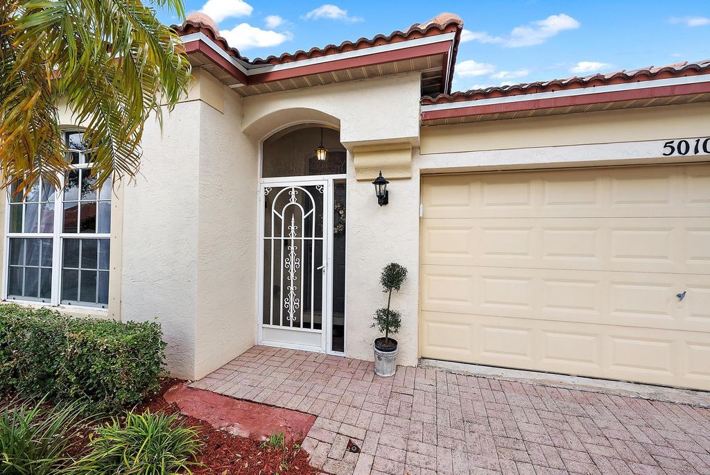 Photo of 5010 Elpine Way, Riviera Beach, FL 33418 (MLS # R11151386)