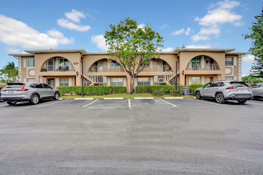 Experience elevated living in this bright, second-floor residence (note: no elevator), boasting higher ceilings and elegant bamboo plank flooring throughout. The spacious main bedroom offers ample closet space. The modern granite kitchen comes equipped with a front-load washer/dryer. Enjoy the peace of mind with all rear windows being tempered and hurricane-resistant.

But the true highlight is the panoramic views from the living room and master suite, featuring a soon-to-be-completed, picturesque tree-lined winding canal. Installed in 2016, the air conditioning ensures year-round comfort.

Seize this fantastic opportunity to invest in a property with expected substantial value appreciation. The adjacent golf course, recently acquired by a builder, promises future access to a state-of the art clubhouse for all Palm Greens residents.

This vibrant, friendly community is a hub of activity, offering walking paths, three exercise areas, a poolside café open for breakfast and lunch, a hot tub, and numerous clubs. Sports enthusiasts will appreciate the great tennis center with nine Har Tru courts and additional ones underway, along with pickleball facilities.

Situated just 7 miles from downtown Delray, you're close to beautiful beaches, award-winning restaurants, boutique shopping, art galleries, and an exciting nightlife. Don't miss out on this unique blend of natural beauty and urban development.