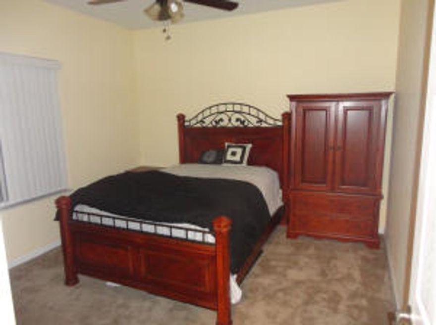 Move in ready home is located within close proximity of 95, Turnpike, schools and shopping at Tradition. This spacious well kept home features an open floor plan including several upgrades and appliances. Kitchen includes custom cabinetry, Granite counters, tile floors, formal dining, and breakfast bar. Master bedroom includes garden tub, dual closets, sinks and shower heads. Large yard with wood privacy fence, Multi zone sprinkler system on well, cabana bathroom and large covered & screened porch.