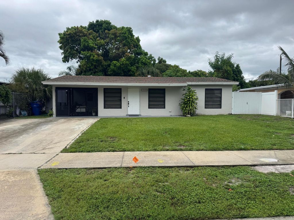 Photo of 1580 W 12th Street, Riviera Beach, FL 33404 (MLS # R11123648)