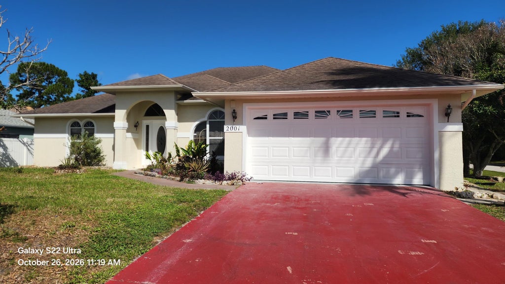 Photo of 2001 SW Altman Avenue, Port Saint Lucie, FL 34953 (MLS # B26092712)