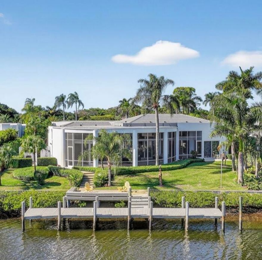 This exceptional home is a classic modern design proving the test of time. From the beautiful 180 ft of waterfront to the large motor court with hidden 3 car garage adorned by elevated landscape and sculpture garden sets the mood of the stately entrance to this extraordinary home. This 4 bedroom residence is on one of the very best deep water lots that Frenchman's Creek has to offer. It is situated on an oversized parcel that is graced with the widest water views in the community. Interior features include; sleek granite floors, clean modern built in cabinetry throughout, 12 ft. glass doors looking out to a huge lanai with stunning canal views. The open primary living space overlooks the pristine marbled pool, spa and waterfall in the amazing courtyard. (SEE SUPPLEMENT) This exceptional home is a classic modern design proving the test of time. From the beautiful 180 ft of waterfront to the large motor court with hidden 3 car garage adorned by elevated landscape and sculpture garden sets the mood of the stately entrance to this extraordinary home. This 4 bedroom residence is on one of the very best deep water lots that Frenchman's Creek has to offer. It is situated on an oversized parcel that is graced with the widest water views in the community. Interior features include; sleek granite floors, clean modern built in cabinetry throughout, 12 ft. glass doors looking out to a huge lanai with stunning canal views. The open primary living space overlooks the pristine marbled pool, spa and waterfall in the amazing courtyard. The sleek kitchen with breakfast nook opens to the garden and water views. The 2 bedroom guest house surrounds the pool area creating an additional private oasis. Truly a magnificent one of a kind opportunity.

Experience the finest of amenities in South Florida's fabulous community of Frenchman's Creek featuring a brand new expansive clubhouse, private beach club, state of the art fitness center, two signature golf courses, tennis, pickleball and renowned service.