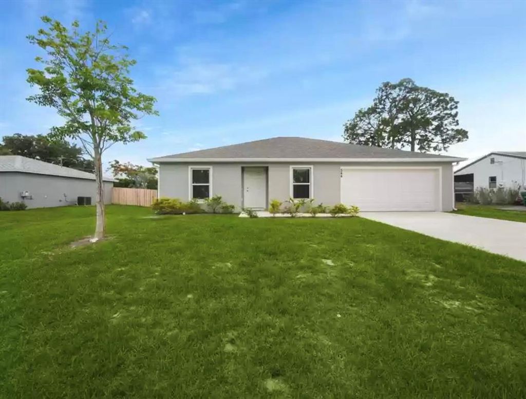 Photo of 544 SE Whitmore Drive, Port St Lucie, FL 34984 (MLS # R10889343)