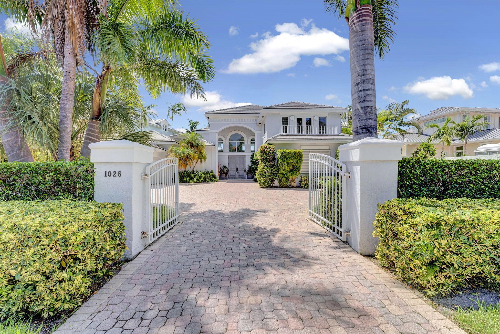 Experience refined coastal living in Delray Beach's prestigious Seagate neighborhood with breathtaking direct Intracoastal views from nearly every room. This 4-bedroom, 4-bath waterfront residence offers a seamless blend of elegance and comfort, featuring wide-plank wood floors, a gourmet kitchen with quartz countertops, spa-quality bathrooms, and an open living space anchored by a stone fireplace. Step outside to a covered patio, heated pool, and private dock with 50 feet of frontage. Gated motor court style driveway, two garages, and impact glass throughout. Just blocks from the beach and vibrant Atlantic Avenue.