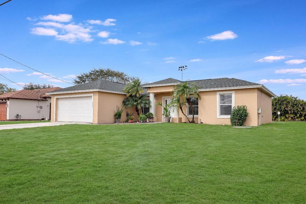 Photo of 757 SW Tulip Boulevard, Port Saint Lucie, FL 34953 (MLS # R10958617)