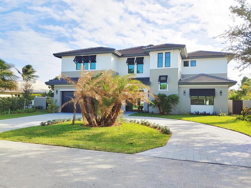 Waterfront Coastal Contemporary inspired estate with 85' of dock space. Rear of the property is the coveted south east exposure. Home features includes, five bedroom four and half baths, private master wing, elevator ready, Thermador appliances, smart home ready and custom cabinetry and more.