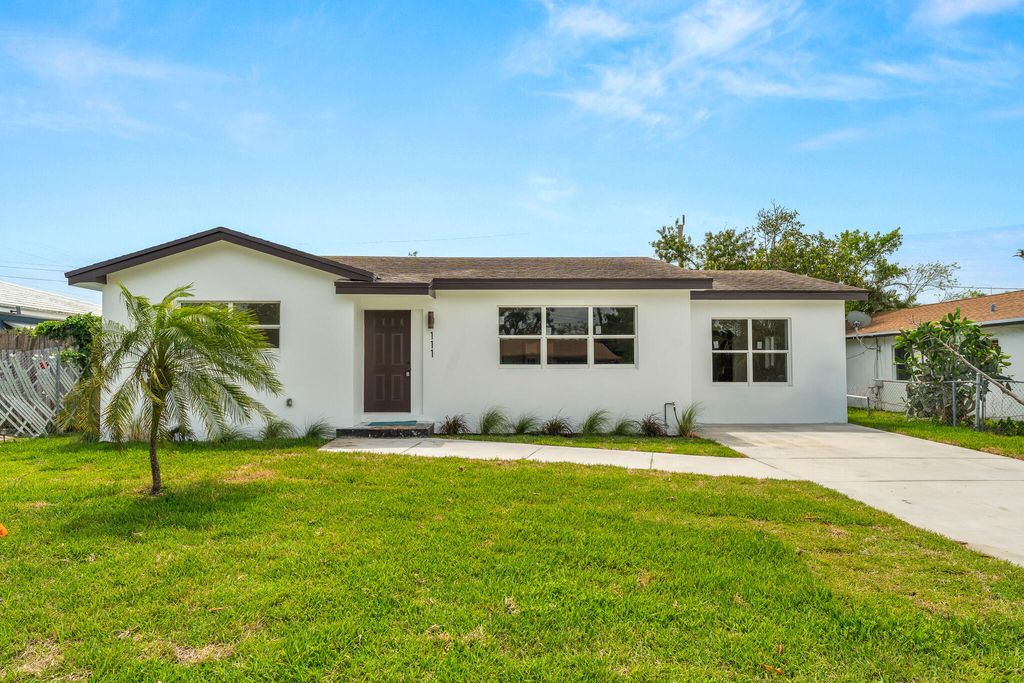 Photo of 111 W 35th Street, Riviera Beach, FL 33404 (MLS # B26014946)