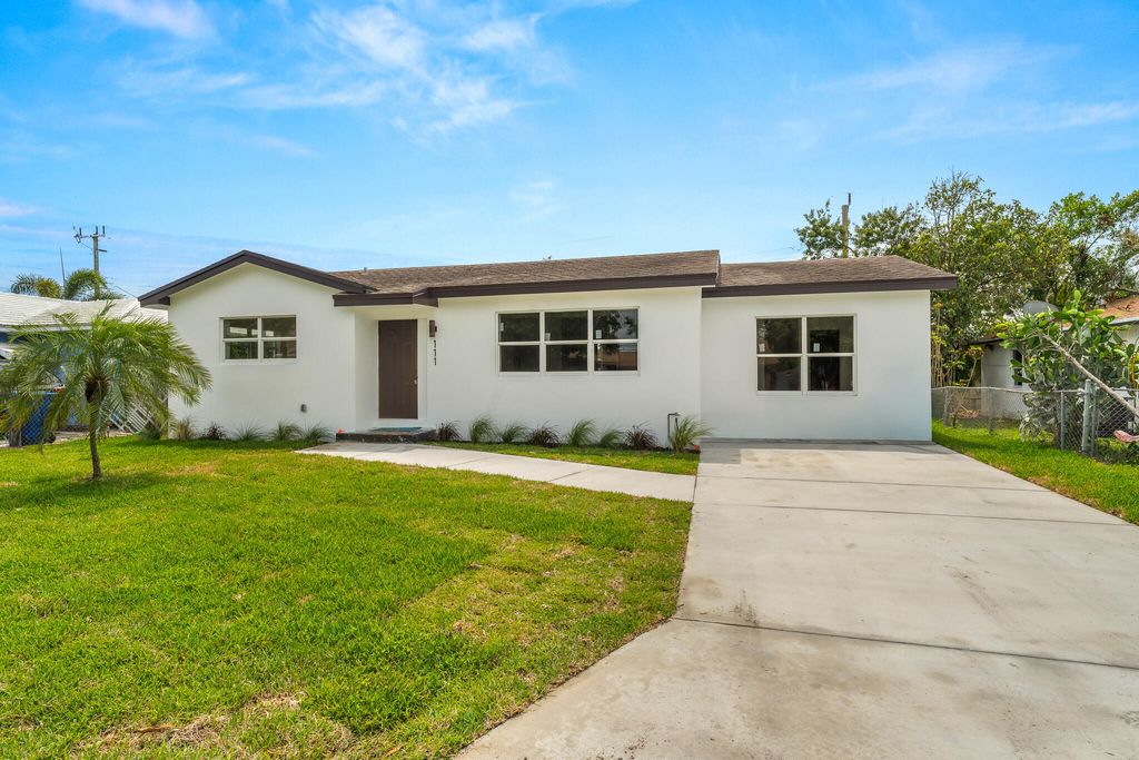 Photo of 111 W 35th Street, Riviera Beach, FL 33404 (MLS # B26014946)