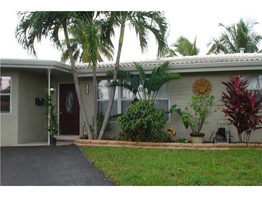 Priced to SELL!  Enjoy Living & Entertaining, low maintenance home!  Huge pool, patio area & backyard.  Get on your boat at your dock & GO!  One fixed bridge (11-12'?)Appx 20 mins to ocean.  3/2 home remodeled with tile floors, new kitchen w/white cabinet ry & island, open to living & dining areas.  French doors leading to outdoors.  New A/C last year, roof in good condition.  Remote controlled awning.  Lush tropical landscaping.  Lots of parking. Great for you and yours!  Enjoy the Florida lifestyle.