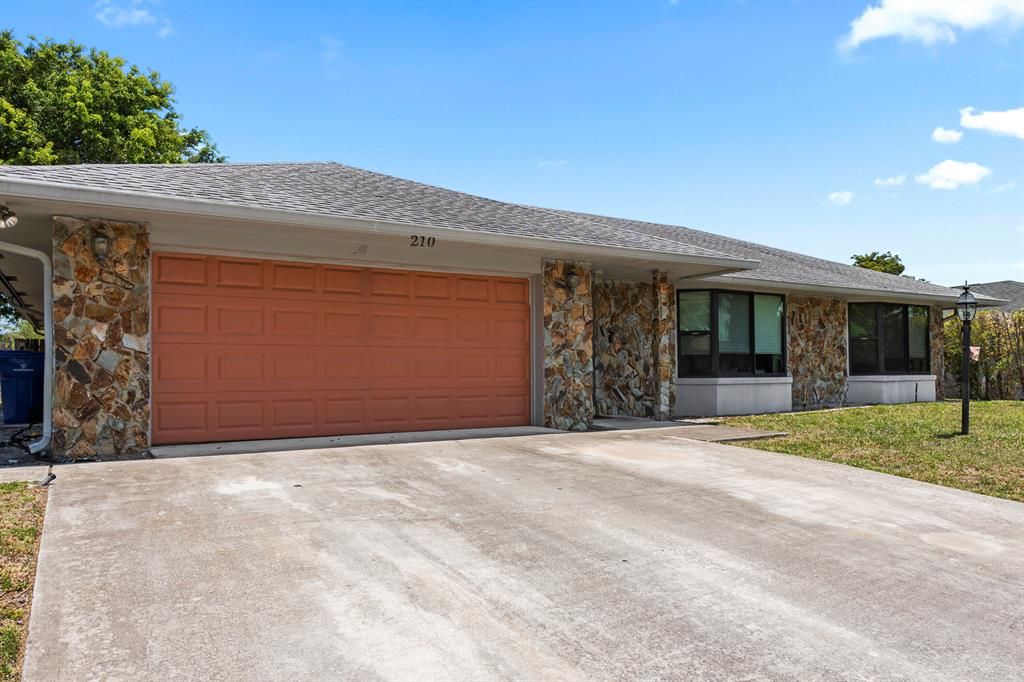 Photo of 210 Lochmore Road, Riviera Beach, FL 33407 (MLS # R10889678)