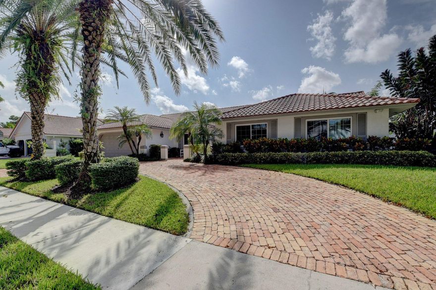 Elegant & updated 4-bedroom oasis in one of Boca Raton's most desirable neighborhoods! This single-story beauty with a circular driveway, boasts volume ceilings, a custom library with a wood-burning fireplace, a chef's kitchen featuring double ovens & a warming drawer, wine refrigerator, and a convenient snack bar and breakfast area. All bedrooms feature closet built-ins. Luxurious primary suite and bathroom features a soaking tub, frameless shower & accesses a private fenced-in pool with travertine tile & outdoor shower. Separate laundry room with front loading machines. Impact sliders & windows too! Beyond the property, New Floresta is a perfectly located neighborhood near Town Center Mall, dining, parks, FAU, 95 and the turnpike. This is an absolute must-see as your dream home awaits!