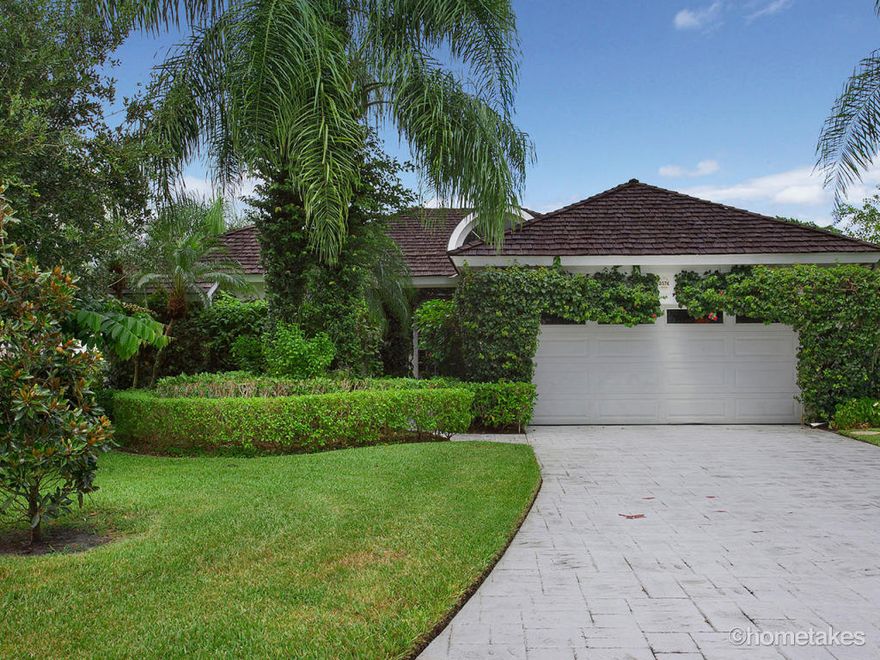 English Country charm and gardens welcome you home through your private gated entry. This home boasts gorgeous views with an abundance of light coming in from the wall of glass windows and French doors to all the living areas and there is even a special room created and devoted just for your best friends, your pets. Some of the amenities include; vaulted ceilings, plantation shutters, a large updated granite and stainless kitchen with double ovens and a well-situated pass through to your formal dining area.  Kitchen also has extra windows to let in the morning light over the breakfast area. Large Master suite has French doors and windows to take in the same gorgeous views. One of the most private lots with breathtaking million dollar lake and golf course views for a fraction of the cost.