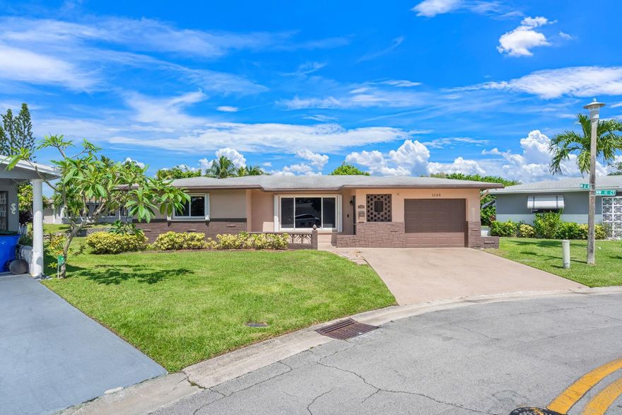 This beautiful home located in Paradise Gardens, a vibrant 55+ community with amenities. Discover this charming 2-bedroom, 2-bath single-family home nestled in a quiet South Florida neighborhood. Enjoy peace of mind with recent upgrades. New A/C unit (2024), hot water heater (2023), and laminate flooring (2022/2023). The kitchen features new stainless-steel appliances (2022) and is ready for your personal touch. Additional highlights include three ceiling fans (2023), exterior paint (2022), window tinting (2022), storm shutters for added protection, a large screened in patio for you to enjoy as you admire a serene canal view right in your backyard—perfect for relaxing or entertaining. This well-maintained home offers comfort, functionality, and great potential in a desirable location.