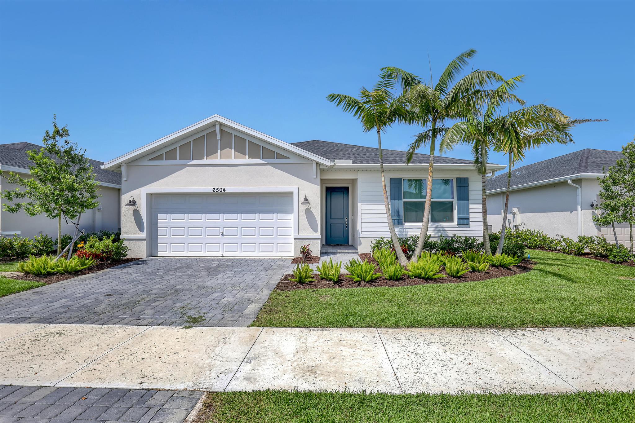 Step into modern comfort with this stunning new construction home in Brystol at Wylder - Reserve Series, located in the heart of Port St. Lucie. Designed with Meritage Homes' signature energy-efficient features, this residence offers both style and sustainability.Enjoy a sleek, contemporary interior featuring:42'' Maple shaker-style cabinetryQuartz countertops paired with a striking mosaic tile backsplash6'' x 36'' natural wood-look tile flooring throughout the main living areas, laundry room, and second bedroomSoft, neutral-toned carpeting in select areas, part of our Modern Rustic design packageNestled within the thoughtfully master-planned community of Wylder, residents enjoy access to resort-style amenities, scenic trails, and a serene lakefront area. Completly fenced.