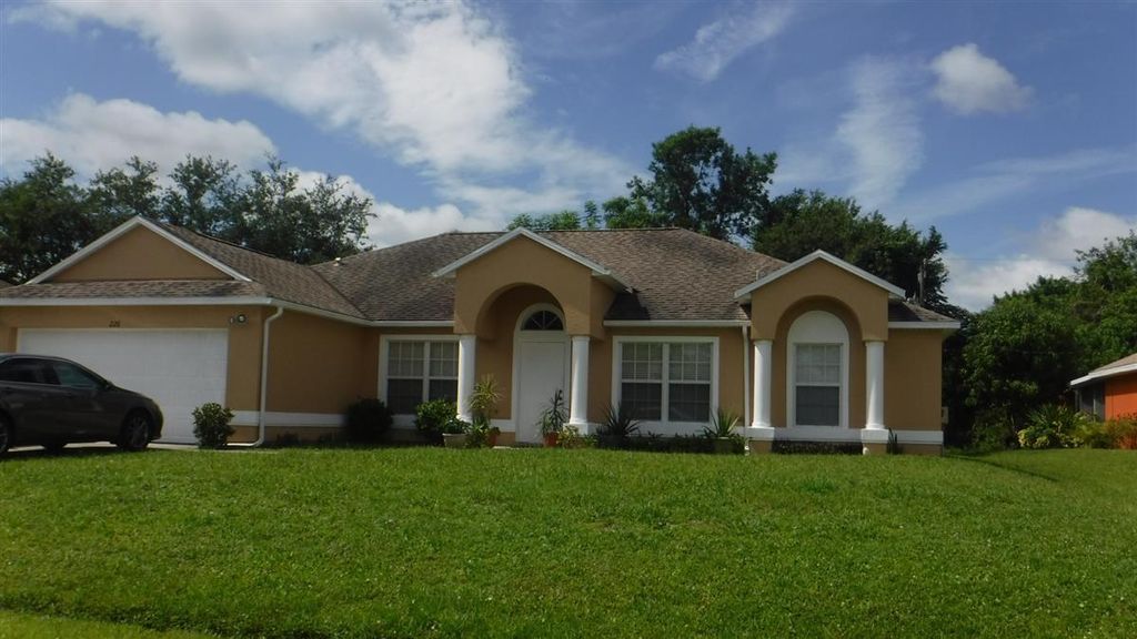 Photo of 226 SW Langfield Avenue, Port Saint Lucie, FL 34984 (MLS # R10948124)