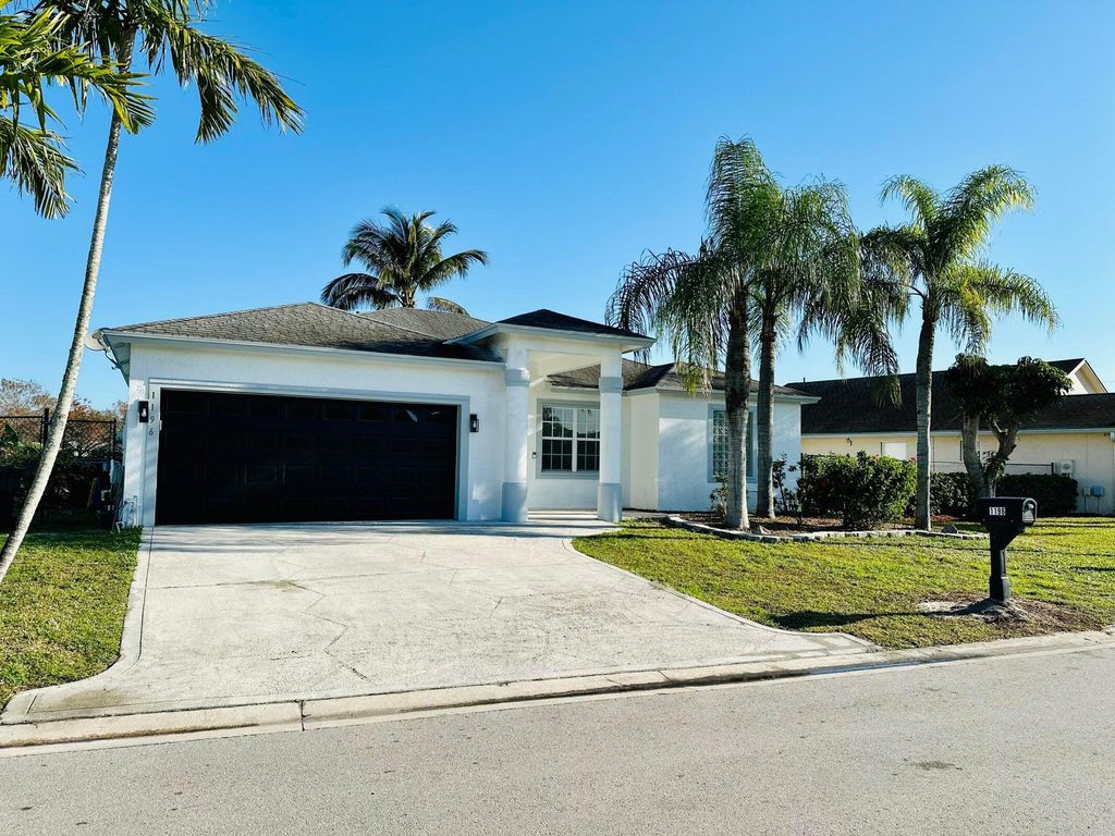 Photo of 1196 Hatteras Circle, Greenacres, FL 33413 (MLS # R11164136)