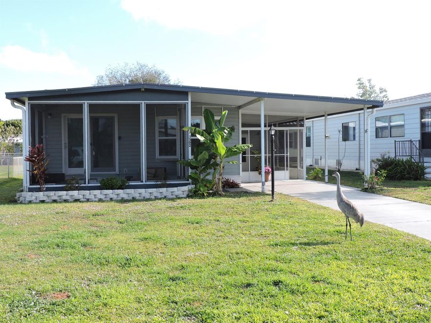 Cute as a Button! This 2/2 home in the renowned Barefoot Bay community has many functional and fashionable updates. The newly remodeled kitchen boasts quartz countertops & new stainless appliances. The impact sliding glass door and windows along the front of the home were installed in 2023. Worry free floor to ceiling tile in shower & bath are another nice touch. Outside updates include: a newly installed side screen porch with a shark coated floor; metal roof was epoxy coated in 2023; Electric service pedestal and wiring to home replaced in 2024($8,000). A must see!!