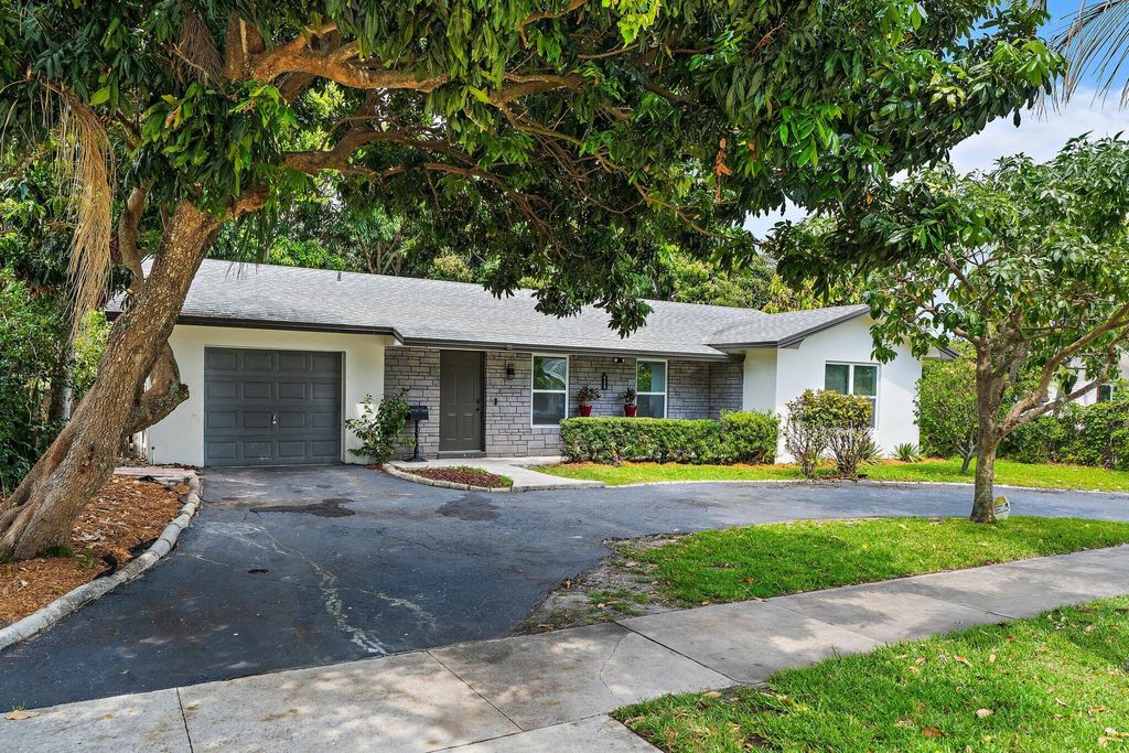 Photo of 425 Greenbriar Drive, Lake Park, FL 33403 (MLS # B26007146)