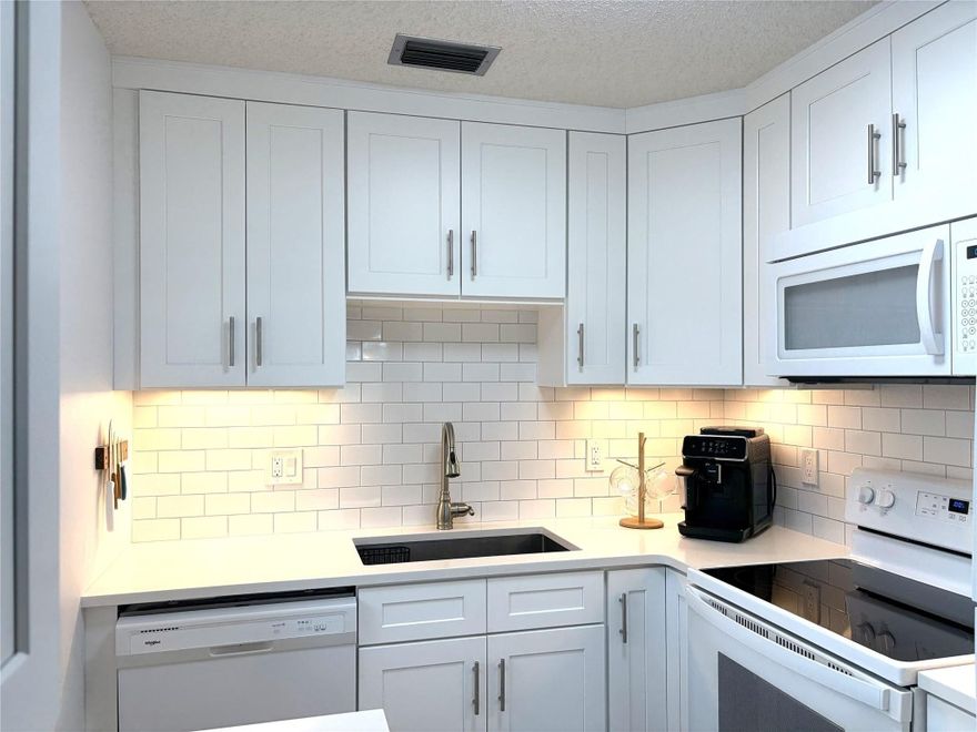 * Meticulously Maintained * Fully Furnished ( If Desired ) 1 Bedroom / 1.5 Bath Condo. 2020 Roof. Impact Windows. Beautiful Tile Throughout. Completely Renovated Kitchen With Custom Cabinets, Full Size Pantry, Subway Tile Backsplash, Quartz Countertops, and a Farmhouse Sink. The Bathrooms Have Been Tastefully Updated As Well. Take In Beautiful Views of The Golf Course and Breathtaking Sunsets From Your Living Room Windows. Enjoy The Many Amenities At Vista Royale Including A Restaurant, 4 Heated Pools, Fitness Center, Tennis, Pickle Ball, Bocce Ball, Shuffleboard, Golf Course, Game Room, Billiards Room, Library, Wood Working Shop, and So Much More. Just Minutes To The Beach, Shops, and Dining.