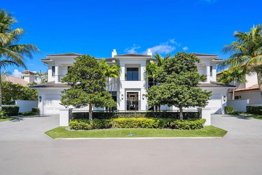 Sitting on 100' of the Buccaneer Palm Waterway within the prestigious Royal Palm Yacht & Country Club, 505 E Alexander Palm Road delights with panoramic waterfront views and first-class amenities. Over 7,400 sf of interior living offers 5 bedroom suites, club room with a bar, library, formal dining space, open-air chef's kitchen, and loft living room. The master bedroom is a tranquil retreat with a luxurious ensuite and glass sliding doors opening to a fantastic balcony spanning the length of the home. The resort-grade backyard offers exceptional luxuries, including a heated swimming pool/spa, a sizable summer room with an outdoor kitchen, and a private dock for the boating enthusiast! Designer furnishings by P&H Interiors included.