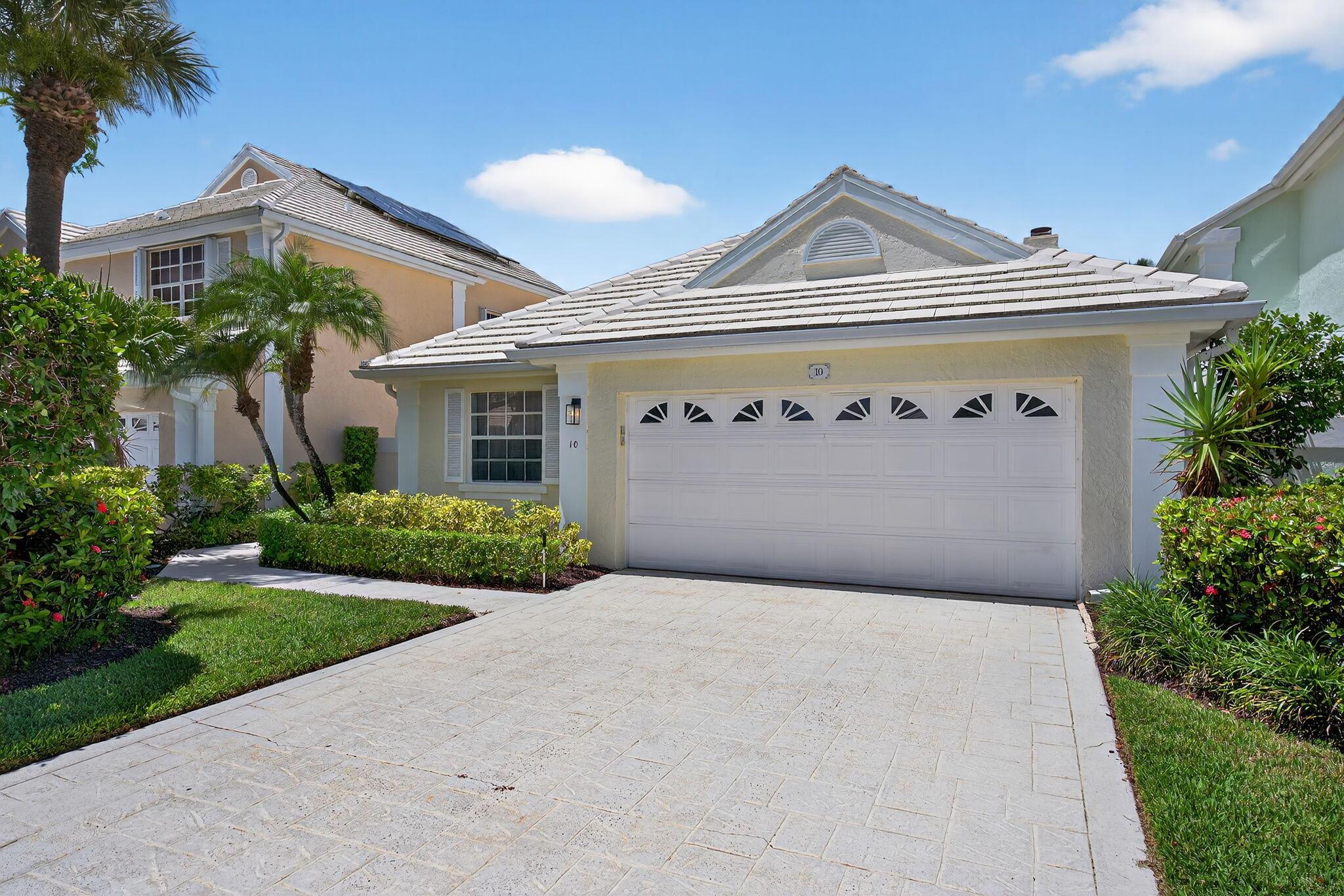 Welcome to this charming single-story home in the gated Barclay Club at PGA National. This 3-bedroom, 2-bath residence offers approximately 1,700 sq ft of comfortable living space, perfect for year-round or seasonal living. Built in 1988 and well maintained, the home features a bright and open layout with a cozy fireplace, updated kitchen with skylight, pantry, and breakfast nook, and a 6-year-old central A/C system.Enjoy Florida living with a private backyard and refreshing dipping pool, ideal for relaxing or entertaining. The enclosed patio adds versatile indoor-outdoor space. Located in a quiet cul-de-sac, this home also includes a 2-car garage and is just minutes from world-class golf, dining, shopping, and beaches. Low HOA and access to the community pool. No membership required.