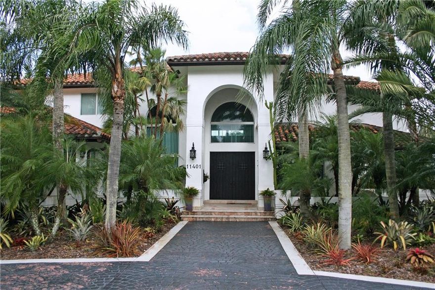 "VILLA TI AMO" Unique resort style custom home on cul de sac acre in Plantation Acres. With over 6,000 sq ft living area, it features a gourmet kitchen, high-end appliances, impact glass & hurricane garage door, security doors & gated entry. Home has gym, office/media room with bar & spacious entertainment area. Outside entertainment area with marble deck, gorgeous free form pool & hot tub, wet bar, fish pond & fountains. Over 8,000 total sq ft. Lush landscaping! Over $200k below appraised value.