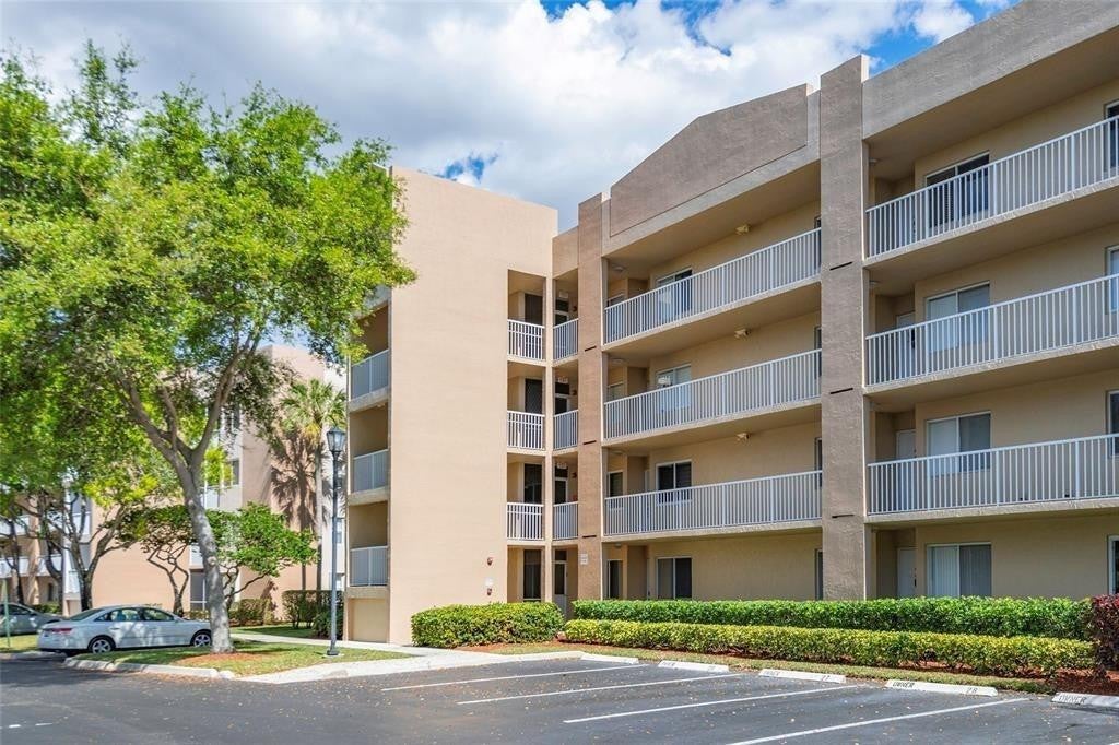 Photo of 9525 Weldon Circle #202, Tamarac, FL 33321 (MLS # F10458021)