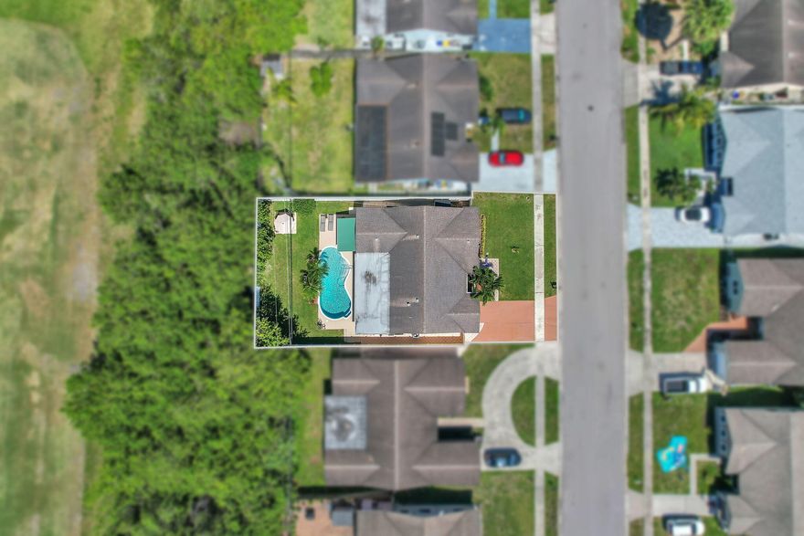 Impeccable 3-bedroom, 2-bath single-family home with NO HOA. NEW ROOF BEING INSTALLED PRIOR TO CLOSING!!! This property Features IMPACT WINDOWS & DOORS, tile flooring throughout, a split floor plan, and recessed lighting. Enjoy a spacious layout filled with natural light, ideal for comfortable living and entertaining. Step outside to a large backyard with a BEAUTIFULLY REMODELED POOL (2024), perfect for year-round South Florida living. Recent upgrades: New A/C (2024), new pool pump & salt system (2022), stainless appliances (2021), water heater (2020), and updated guest bath. Move-in ready and conveniently located near shopping, dining, and top-rated schools. Easy to show—schedule your tour today! Property is in excellent condition and shows true pride of ownership. No HOA—ideal for investors, Airbnb potential, or homeowners seeking flexibility with no rental or association restrictions (buyer to verify). Spacious backyard offers plenty of room for entertaining, pets, or future enhancements. Pool area is fully updated and ready for enjoyment.  Split floor plan provides added privacy, with generous bedroom sizes and functional layout. Impact windows and doors offer added security and insurance benefits.  Roof will be replaced prior to closing, offering peace of mind to the buyer. All major systems have been updated in recent years. Convenient access to major highways, shopping centers, dining, and schools.  All information deemed reliable but not guaranteed. Buyer and buyer's agent to verify all measurements and details.