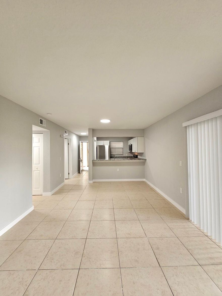 Beautifully fully renovated 1 bedroom, 1 bathroom entry-level unit featuring a modern kitchen with brand-new cabinetry, granite countertops, and stainless steel appliances. Elegant ceramic tile flooring runs throughout the entire home. The bathroom has been completely updated with a new vanity and fixtures, complemented by stylish new lighting throughout. Enjoy the convenience of being located right next to the building's laundry room, plus a spacious storage closet. Ideally situated just minutes from the Florida Turnpike with easy access to all major roads. Well-maintained community offering resort-style amenities including a pool and fitness center.