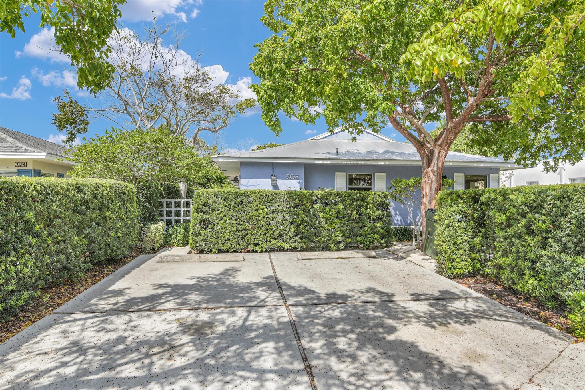 Back on the market and fully reimagined! This beautifully remodeled residence in East Delray's coveted Palm Trail neighborhood offers the perfect blend of modern design and coastal charm, and a short walk to the beach. Featuring brand new tile flooring throughout, an open-concept kitchen with sleek cabinetry, quartz countertops, and stainless steel appliances, this home is move-in ready and redesigned to impress.Enjoy peace of mind with impact windows throughout and a brand new Trane air conditioning unit. The home includes two spacious bedrooms and two fully renovated bathrooms, including a light-filled primary suite with a large walk-in closet and a private patio ideal for relaxing. The living room features stunning wood-paneled vaulted ceilings and is flooded with natural light.