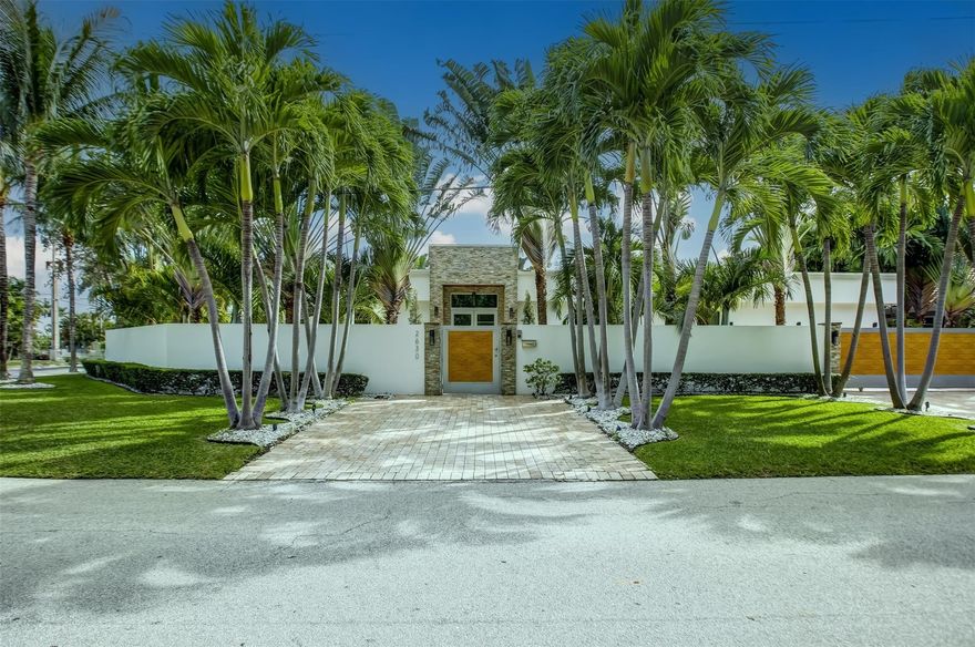 A PIECE OF PARADISE IN FLORIDA! Rarely available East of US1. Modern Private Oasis located on a large fully walled corner lot in the desirable Bayview School District of Coral Ridge. Spacious 4 bedrooms, 5 bathrooms house. Grand foyer entry to an open floor plan & spacious living area w/ floor to ceiling impact glass. Tile flooring. Wine display & large kitchen w/ a solid marble cooking island, Viking appliances. Sold furnished. Bright home with lots of natural light. Oversized bedrooms, modern bath amenities & customized walk in closets. Security alarm & camera system. Sliders lead out to a private backyard w/ summer kitchen, heated pool w/ water feature perfect gathering space for family & guests. A rare newer construction home. Great location minutes to the Beach & shopping.