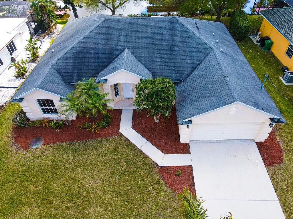 Photo of 126 NE Surfside Avenue, Port Saint Lucie, FL 34983 (MLS # R10968392)