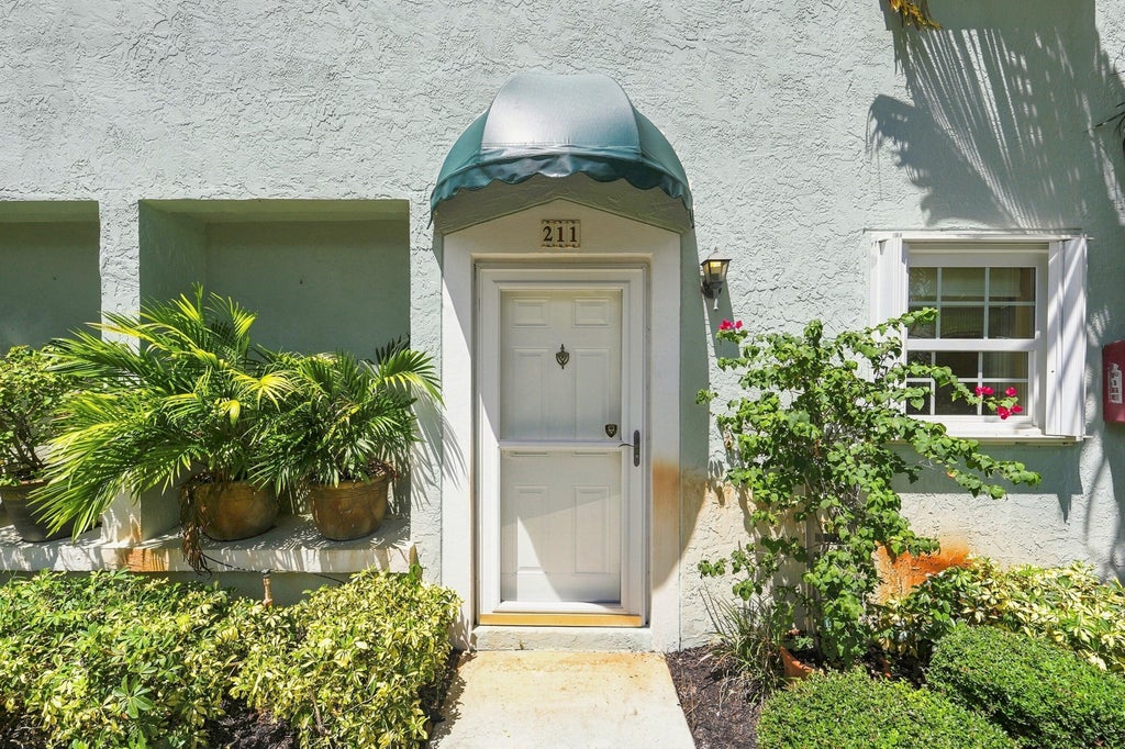 Photo of 211 Waterside Drive, Hypoluxo, FL 33462 (MLS # B26071158)