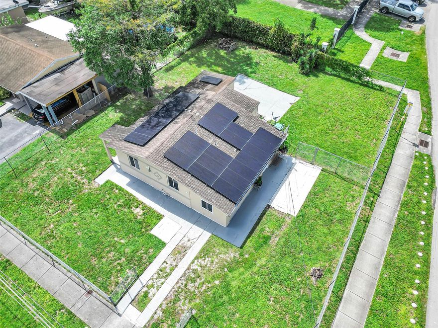 Rare Find in Lauderhill! This spacious home sits on a nearly 8,000 sq ft lot with NO HOA offering the freedom to make it your own. Features include impact windows, solar panels, a new AC system, updated electrical panel, replumbing, and renovated bathroom. The enclosed porch has been transformed into a  bonus room, adding valuable living space. This move-in ready property is minutes from Fort Lauderdale beaches, shopping, and major highways. With a private backyard big enough for a pool and endless outdoor entertaining, this home is ready for South Florida living. Don’t miss the chance to own in a growing area with strong rental demand.