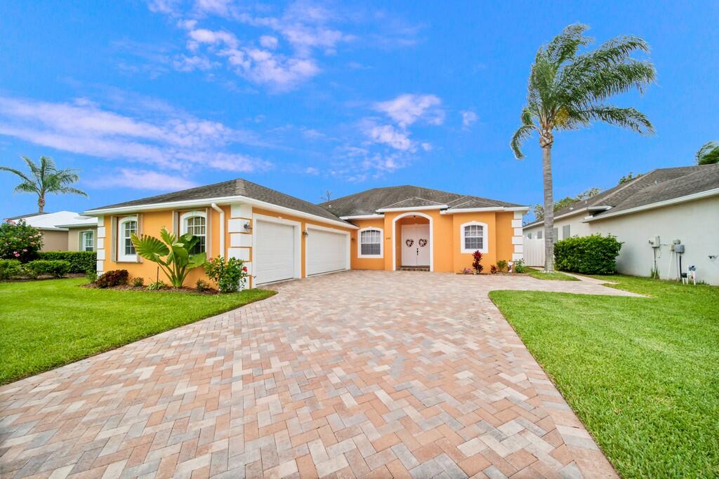 The whole family will love this spacious 4 bed, 3 bath, 3 Car Garage, POOL & SPA Home with fully fenced yard in the very desirable Pines Community in Jensen Beach. Enjoy Florida living with your screened-in lanai & covered patio! This solid concrete block home has accordion shutters/panels & large paver drive. Great split floorplan with open kitchen/family room with separate formal living and dining room -10ft ceilings- great for entertaining. All 3 bathrooms have been updated with new tile and 2 with new vanities. Kitchen features granite counter tops, 42-inch cabinets, pantry, SS appliances, & deep farm sink. Your master wing has a slider out to the patio, 2 walk in closets, 2 bathroom vanities with separate soaking tub & shower. The Pines is a great location close to beach & downtown.