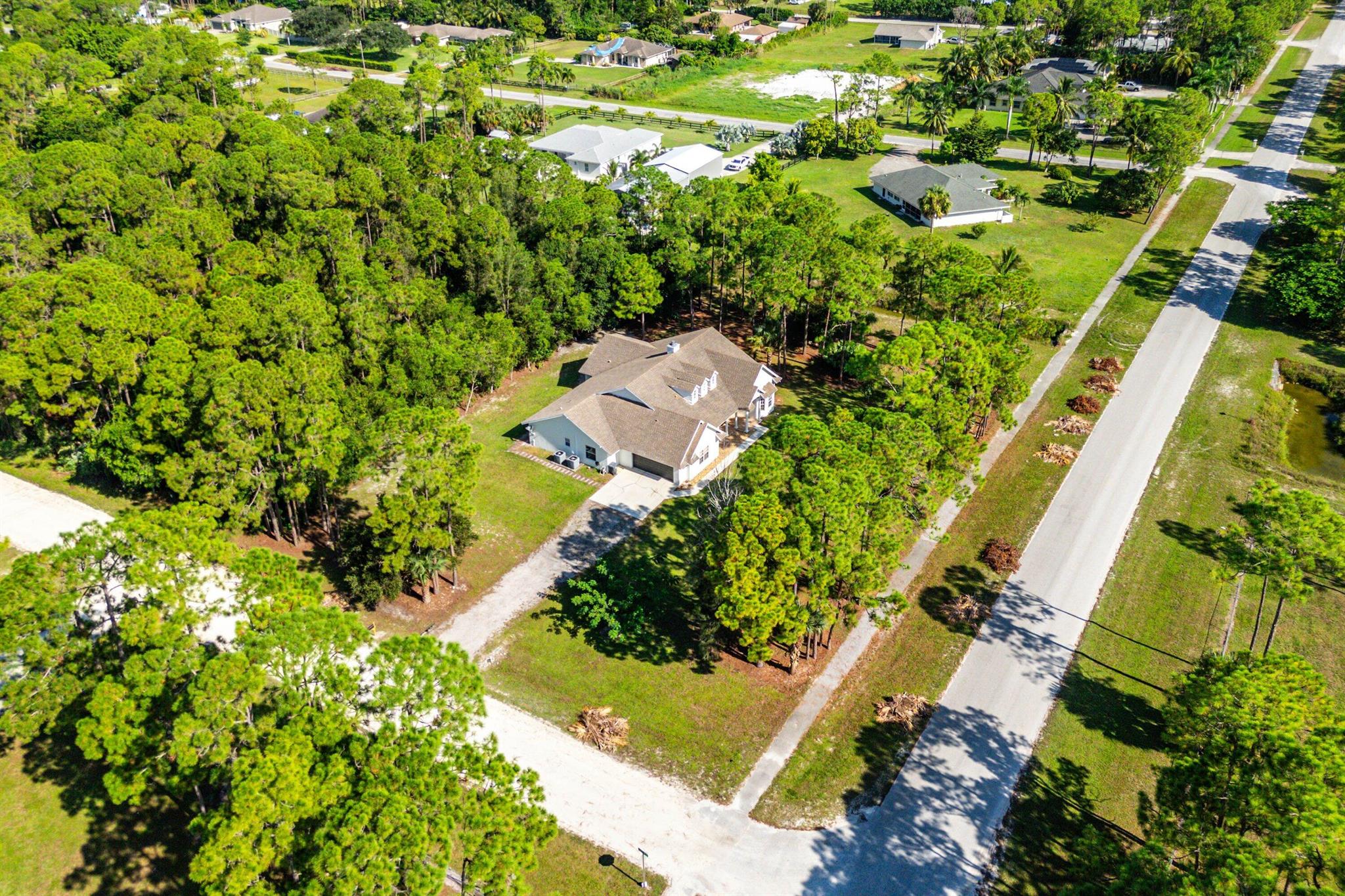 Welcome home to this spacious four bedroom, two bathroom residence with a two car garage, a full movie room, no HOA, and a generous 1.53 acre corner lot.Notable updates include new split A/C units with garage cooling (2024), a whole-home water softener and Oxygen Chamber (AIO) filtration system (2023), real hardwood flooring in the living room, RF remote-controlled blinds for the cathedral ceiling windows, and in-wall surround sound speaker/cable that runs in the movie room, office, and living room. The property is also equipped with smart home features controlling both thermostats, interior and exterior lighting, ceiling and bathroom fans, the Schlage front door lock, and the water heater.As you step inside, you are greeted by refined details and thoughtful upgrades. The