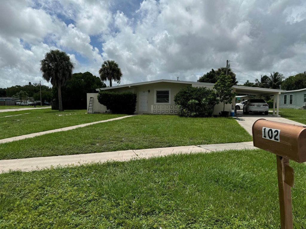 Photo of 102 SE Bonita Court, Port Saint Lucie, FL 34983 (MLS # R11017991)