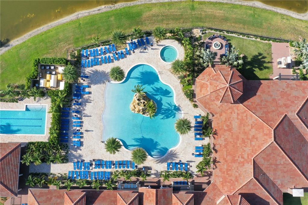 Experience the vibrant 55+ community in Parkland with its 24,000 sqft of amenities for your pleasure. Engage in an abundance of activities such as pickleball, tennis, pools, gym, yoga, cooking classes, theater, bingo, and more. Come and connect with fellow residents and forge new friendships in this lively and welcoming environment.
It's time to relax on the screen patio and savor the lake view where wildlife thrives in harmony. This home has 2 bedrooms, a den, 2 bathrooms, a powder room, a formal dining room, and a large open space facing the lake. The gourmet kitchen features gas burners, stainless appliances, two ovens, and a large pantry. Don't miss the opportunity to immerse yourself in this remarkable community, where relaxation, social connections, and endless possibilities await.