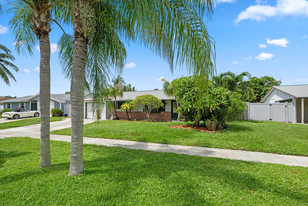 Photo of 12069 Easterly Avenue, Palm Beach Gardens, FL 33410 (MLS # B26074456)