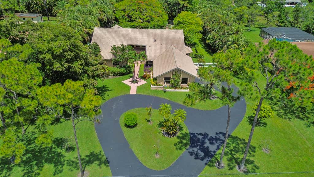 Photo of 6044 NW 66th Way, Parkland, FL 33067 (MLS # B26039584)